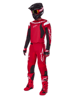 Alpinestars 2025 Fluid Haul Gear Set, motorcrossuitrusting, felrood met zwarte en witte accenten, volledige outfit inclusief jersey, broek, helm, laarzen en handschoenen, ontworpen voor off-road prestaties en bescherming