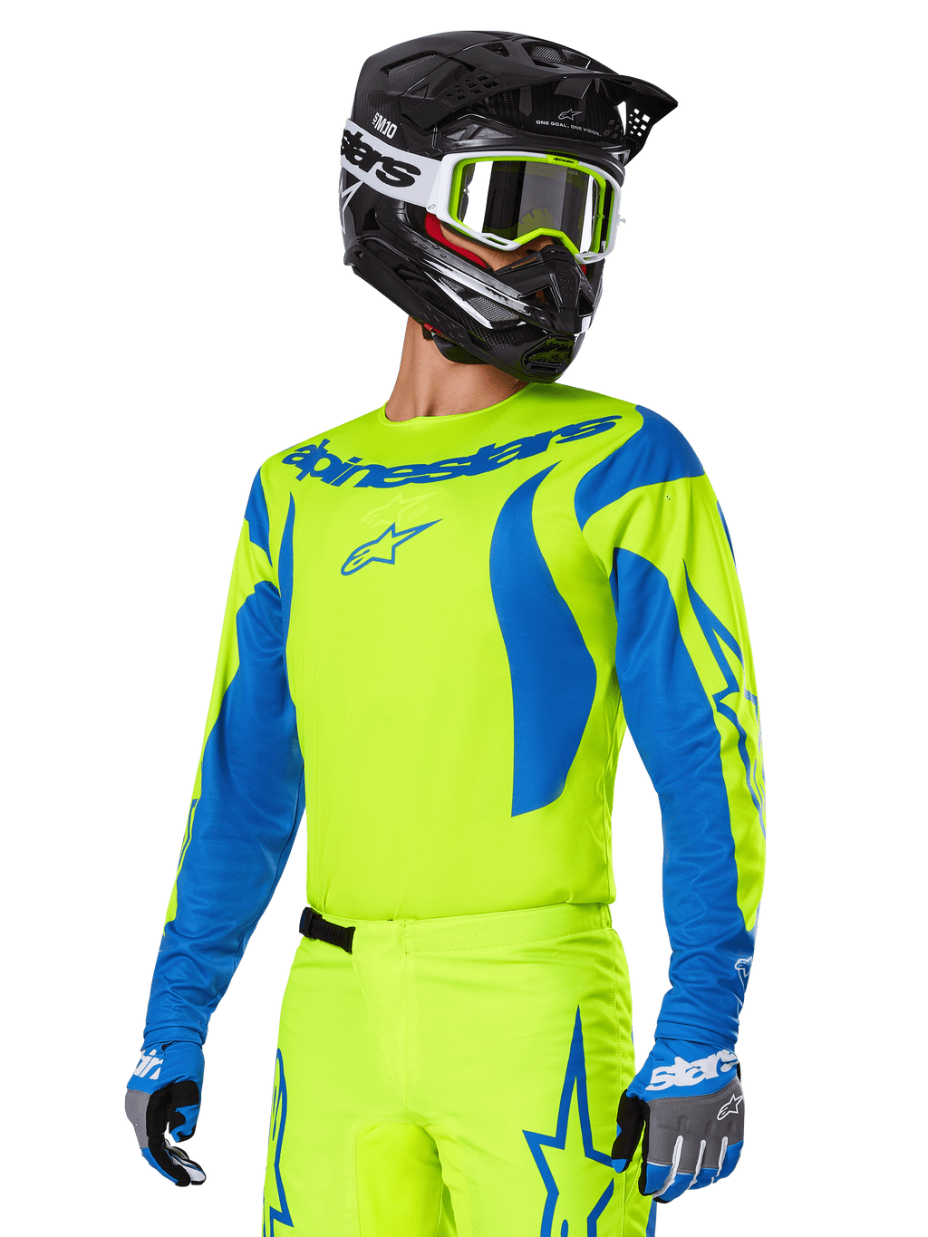 Alpinestars 2025 Fluid Haul gearset, motorcross jersey en broek, felgeel en blauw, gedragen met een zwarte helm en crossbril met geel montuur, voorzien van blauwe golfpatronen op de mouwen en blauwe sterlogo's op de broek, bijpassende off-road race-outfit