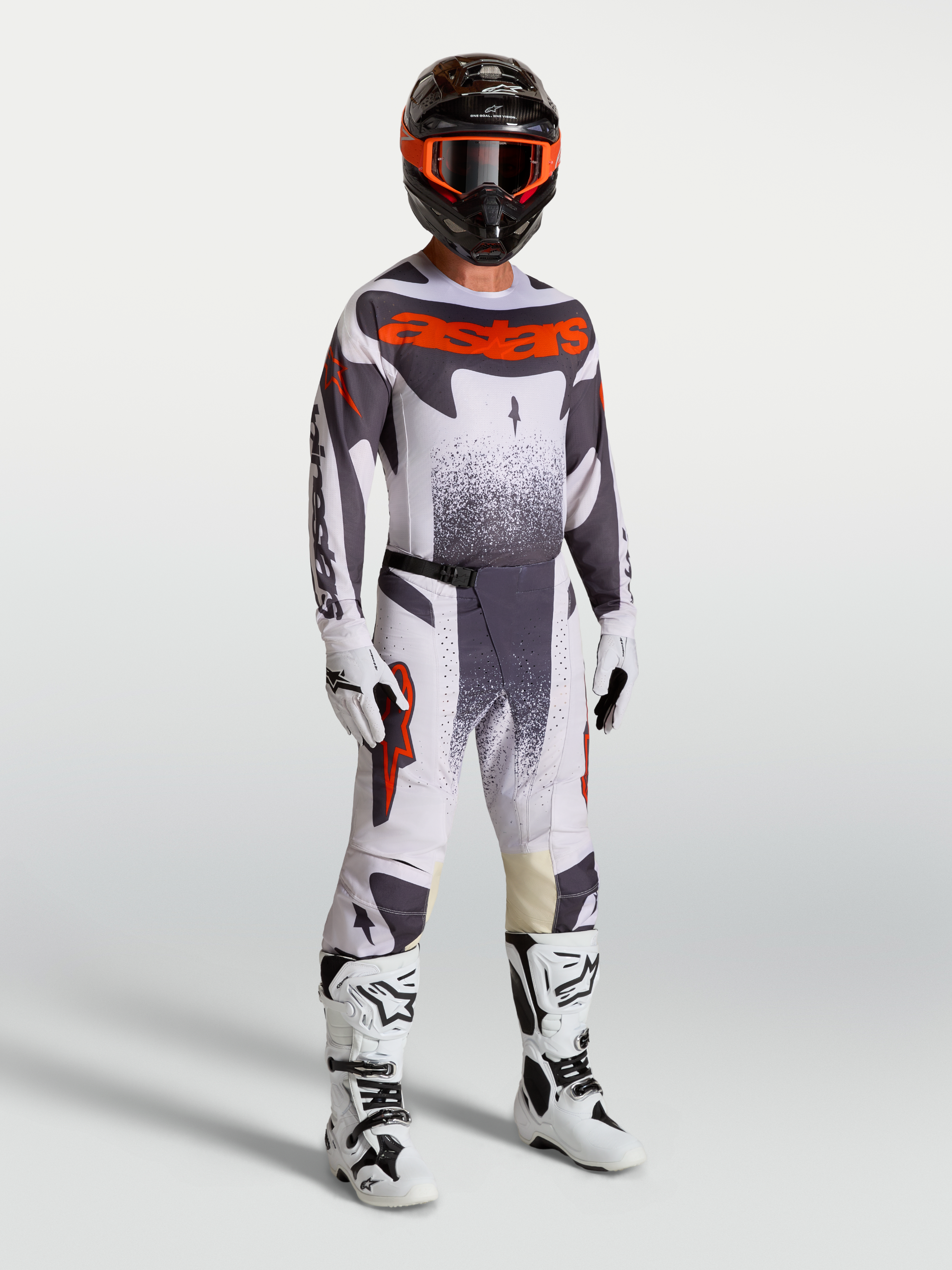 Alpinestars 2027 Techstar Swan Gear Set, professional motocross racing outfit in light lilac, dark gray, and red fluo on a model with white boots and helmet.