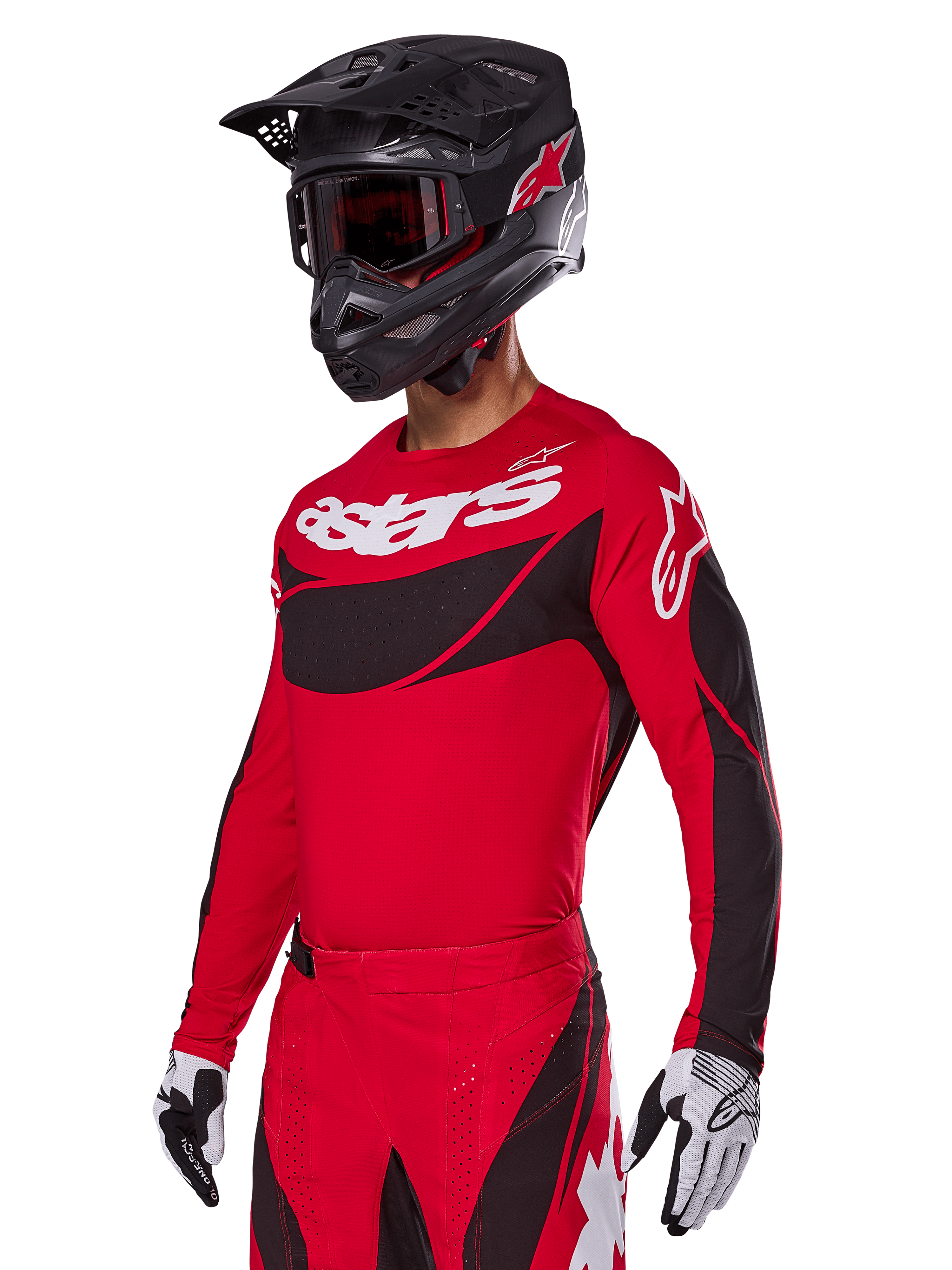 Alpinestars 2025 Techstar Dreem Gear Set, rode motorcross jersey en broek met zwarte en witte accenten, gedragen met een zwarte helm en crossbril, witte en zwarte handschoenen, voorzien van opvallende 'astars' branding, ontworpen voor prestatiegerichte off-road racing