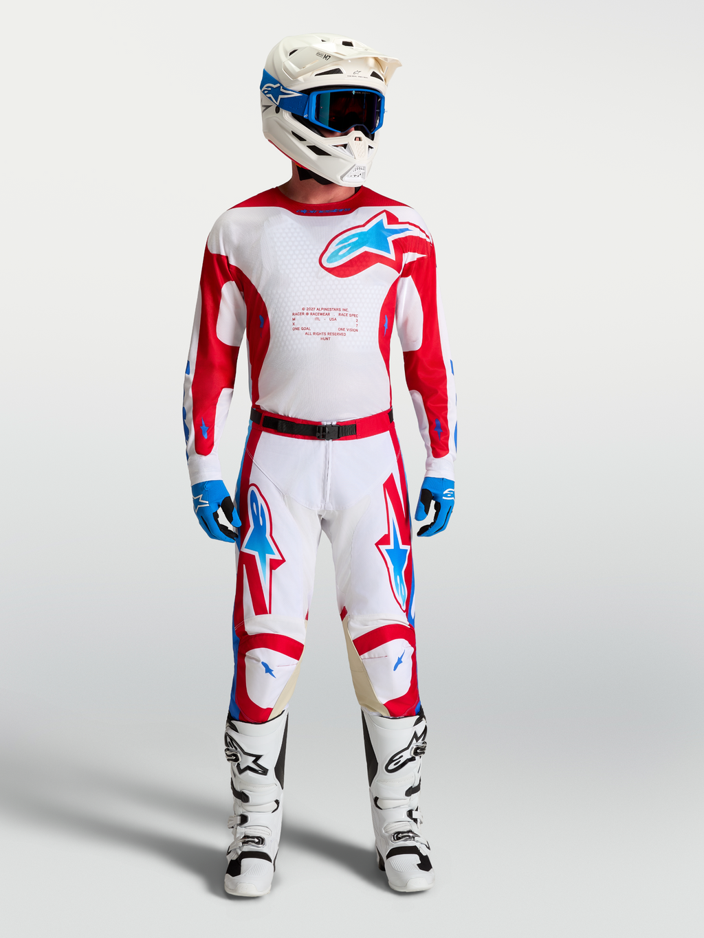 Alpinestars Racer Hunt broek, motocrossbroek in wit en rood met blauwe accenten en een voorgevormde ergonomische pasvorm.