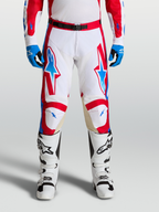 Alpinestars Racer Hunt broek, motocrossracebroek voor heren, wit, rood en blauw, met leren kniepanelen.