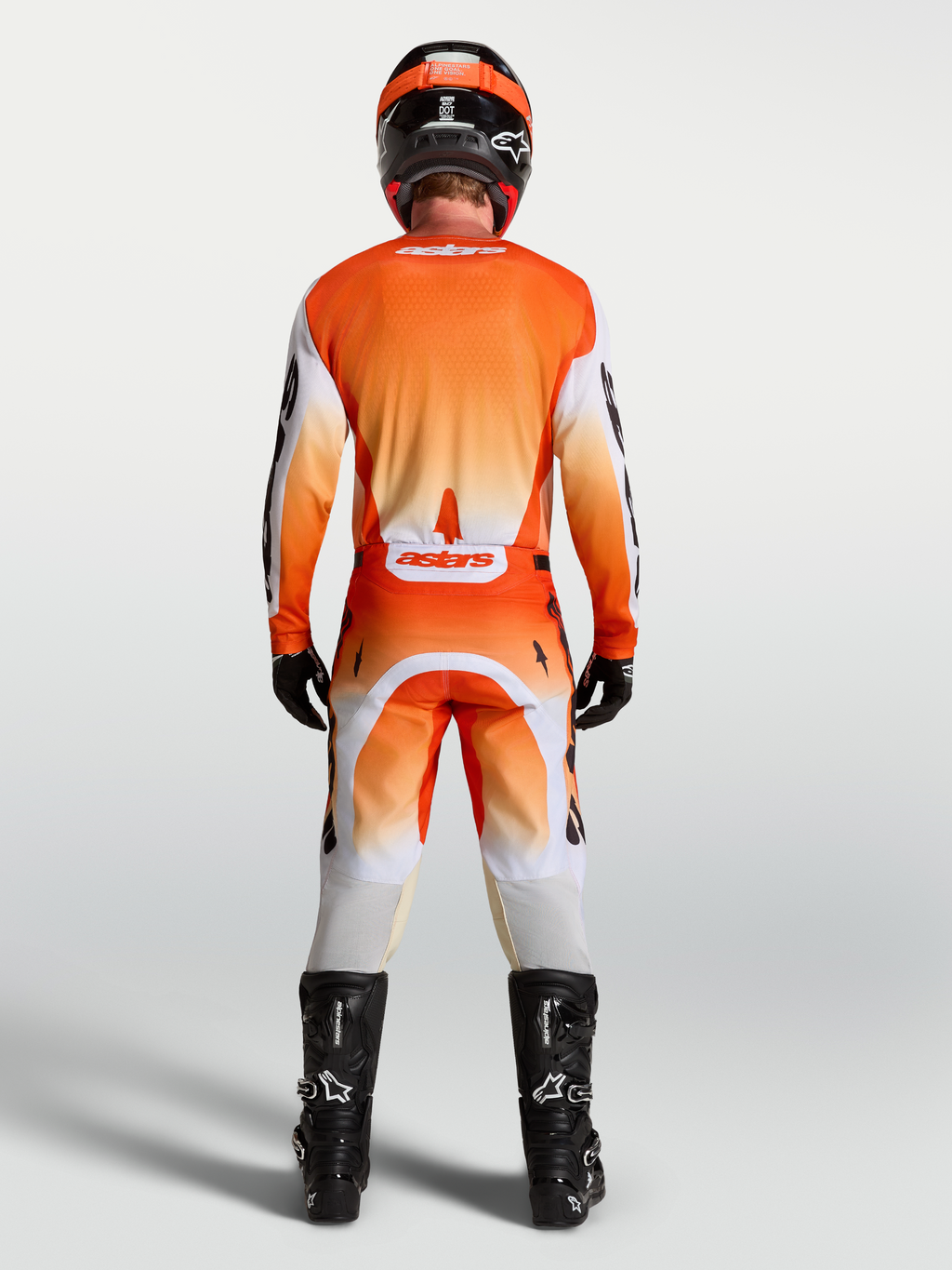 Alpinestars Racer Amber broek en uitrustingsset, heren-motorcrossoutfit, oranje en wit, achteraanzicht.