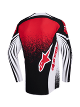 Alpinestars 2026 Techstar Nomur Jersey, motorcross jersey, zwart wit en rood, achteraanzicht met een groot rood Alpinestars-logo, gespikkeld gradiënt-effect en dynamische gebogen patronen op de lange mouwen, hoogwaardige racekleding