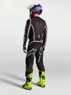 Alpinestars Fluid Apex V2 jersey, heren motorcrossjersey in zwart en zilver, sportieve pasvorm van achteren gezien.