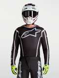 Alpinestars Fluid Apex V2 jersey, herenmotorcrossjersey, zwart en zilver, groot sterlogo, atletische pasvorm.