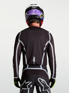 Alpinestars Fluid Apex V2 heren-jersey, zwart en zilver, achteraanzicht met ergonomische atletische pasvorm.
