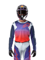 Alpinestars 2024 Racer Hoen Jersey in Light Gray Hot Orange Black, Motocross Jersey worn by a rider with matching gear, featuring a vibrant color gradient and the Alpinestars star logo on the chest, designed for off-road performance.