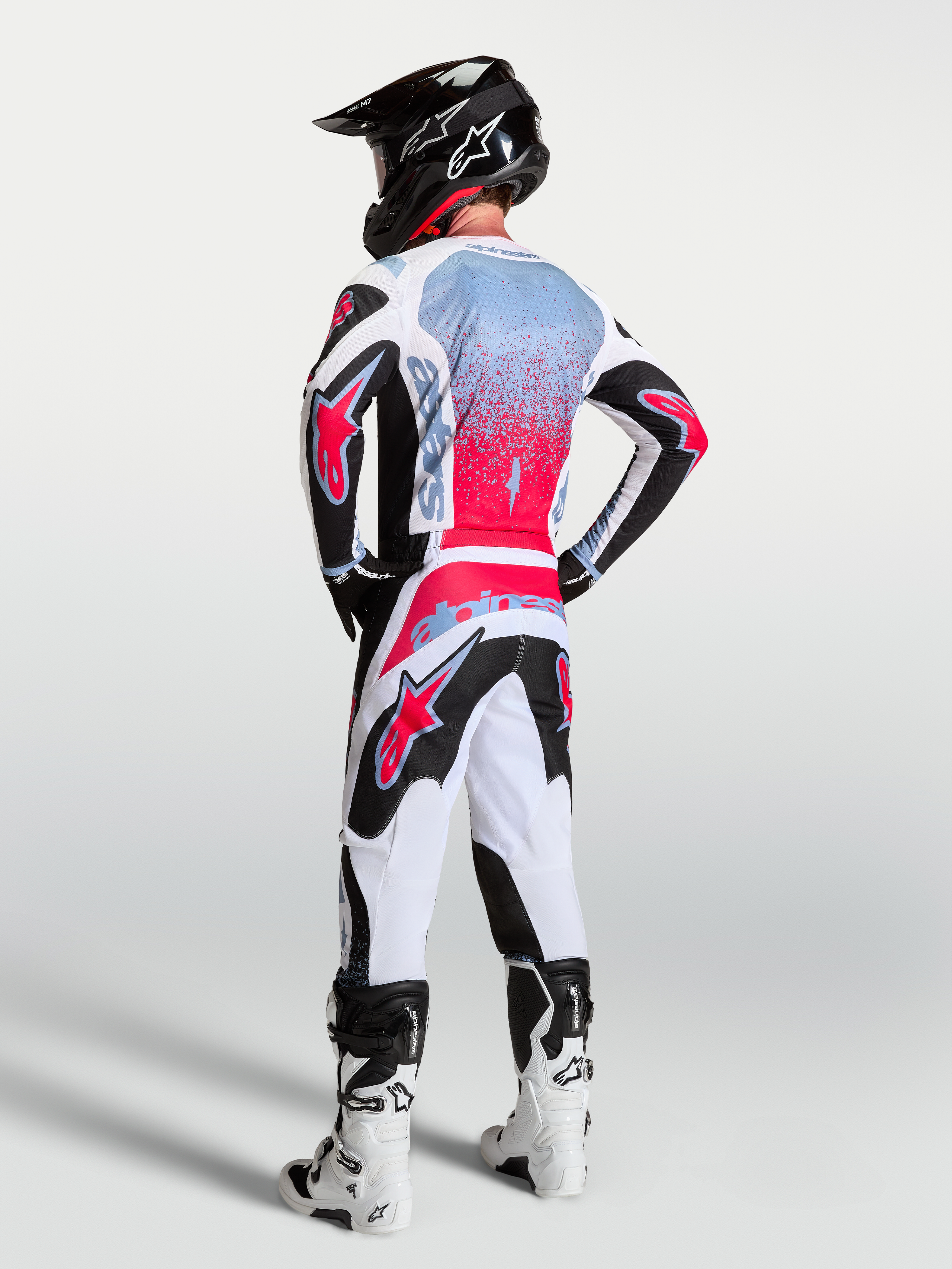 Alpinestars Fluid Drag Jersey, Men's Motocross Gear, Black and Red Fluo, breathable moisture-wicking textile, rear view on model.