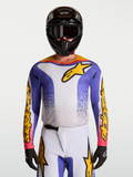 Alpinestars Fluid Drag jersey, heren-motocrossjersey in blauw iris en goud met vochtafvoerende stof.