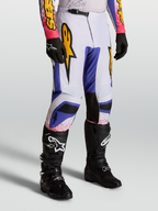 Alpinestars Fluid Drag broek, motorcrossbroek heren, blauw en licht lila met gouden graphics, ergonomische sportieve pasvorm.