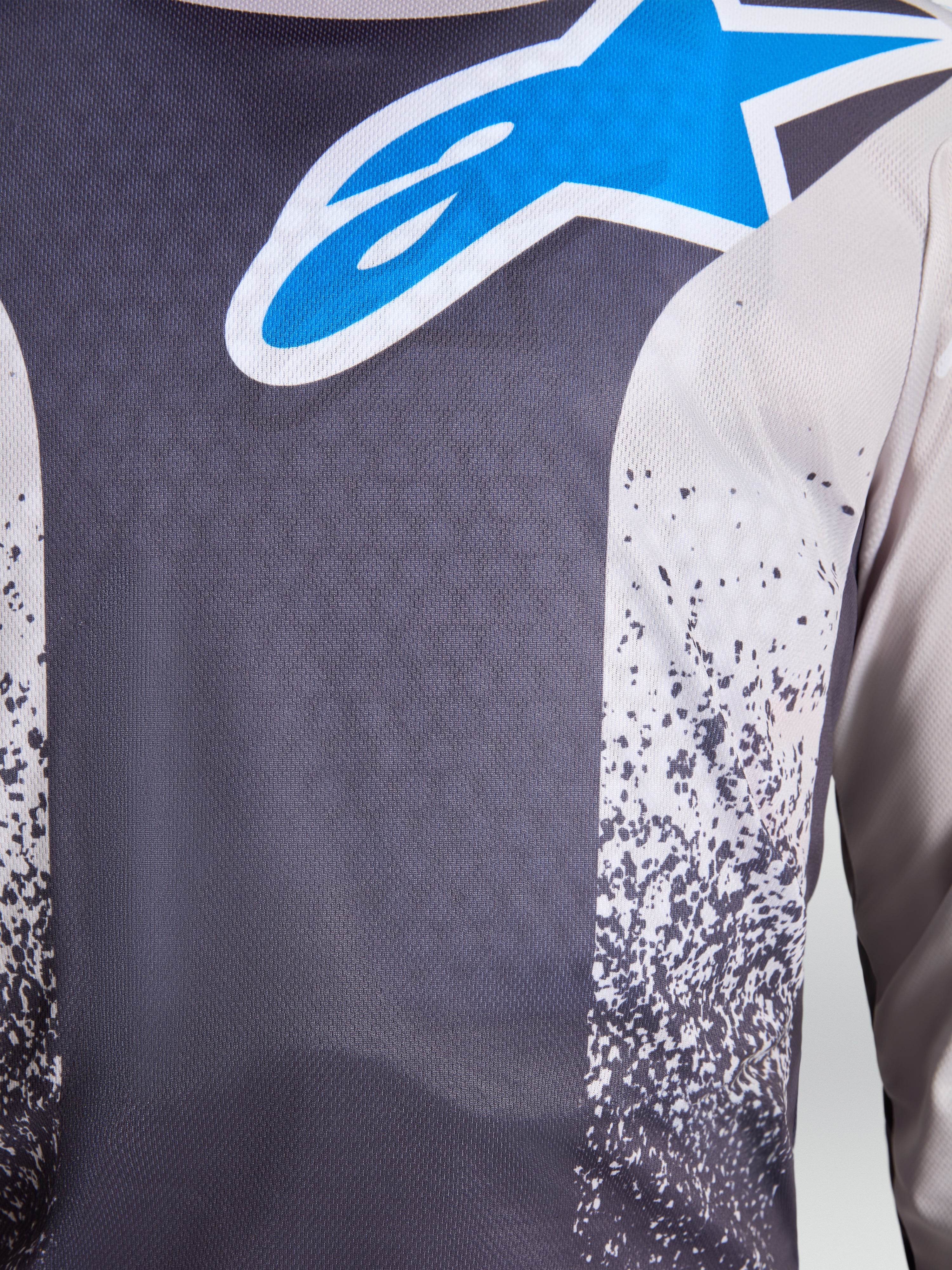 Alpinestars Fluid Drag Jersey, motocrossjersey voor heren, grijs en blauw, ademend vochtafvoerend polyfabric met groot sterlogo.