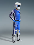 Alpinestars 2026 Racer Air Portl Gear Set, Motocross rider wearing complete ventilated racing gear, Blue and white jersey with matching pants, white helmet with blue goggles, blue gloves, white and black boots, high-performance outfit for off-road riding