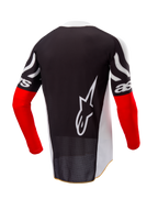 Alpinestars Limited Edition Techstar Deep Jersey, motocross shirt, achteraanzicht, zwart en wit met High Red mouwen, groot wit Alpinestars-logo op de rug, atletische race-pasvorm met geperforeerde poly-stof