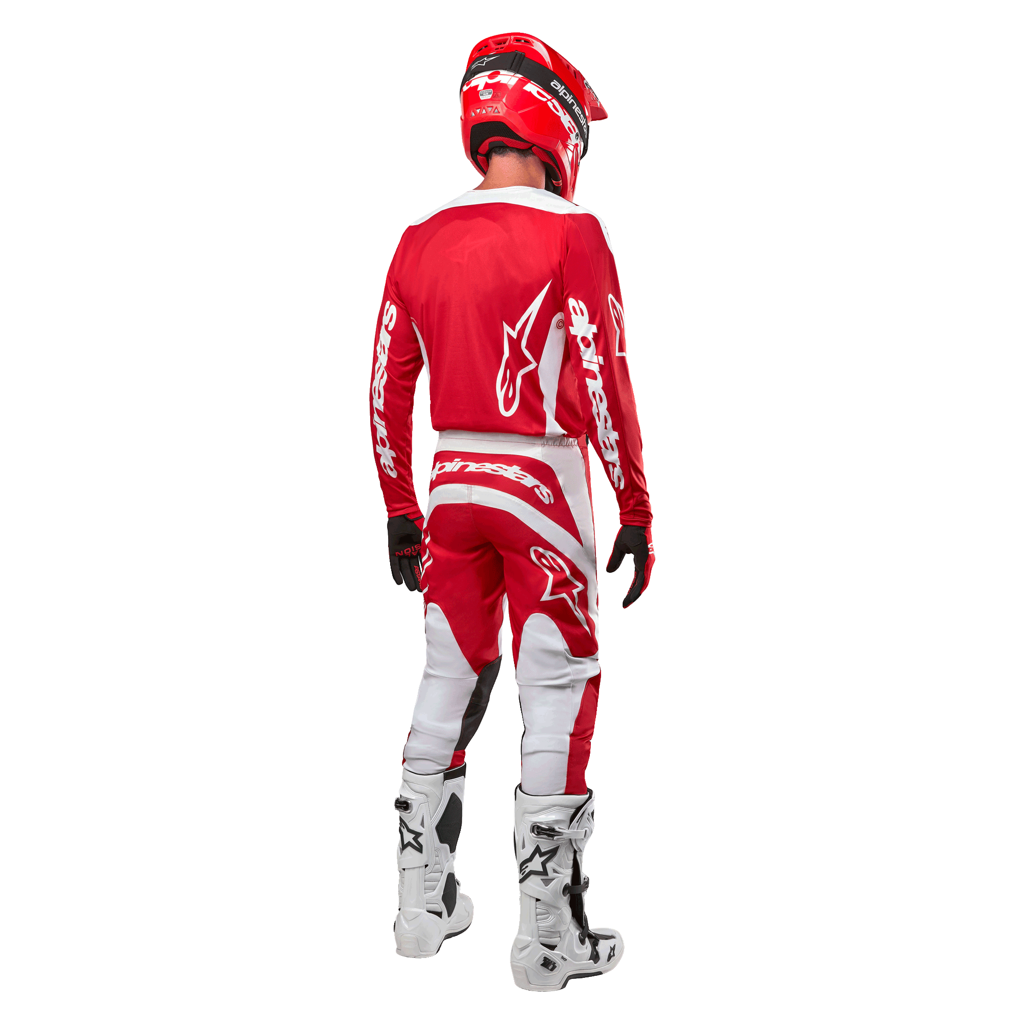 Achteraanzicht van een motorcrosser die de Alpinestars 2024 Fluid Lurv Jersey in Mars Red White draagt, gecombineerd met een bijpassende rood-witte broek, witte off-road laarzen en een rode helm, waarbij het rugontwerp en de Alpinestars-branding getoond worden.