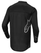 Alpinestars Fluid Graphite Jersey, motocross shirt, zwart en donkergrijs, achteraanzicht, met groot grijs Alpinestars-logo op de zijkant en graphics op de mouwen, lichtgewicht vochtafvoerende stof voor off-road racen