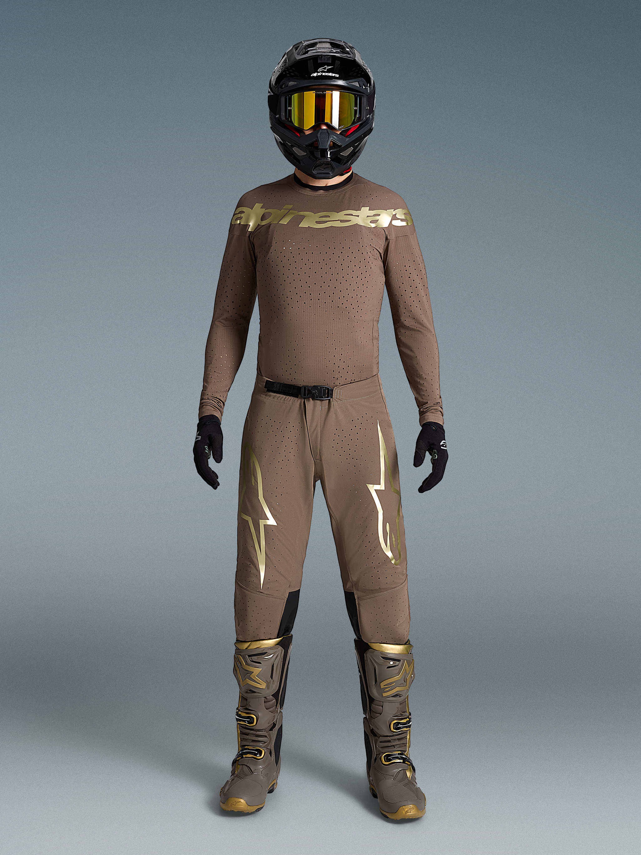 Limited Edition Supertech Air Gold Gear Set, tan motocross outfit with metallic gold logos, matching boots and helmet.