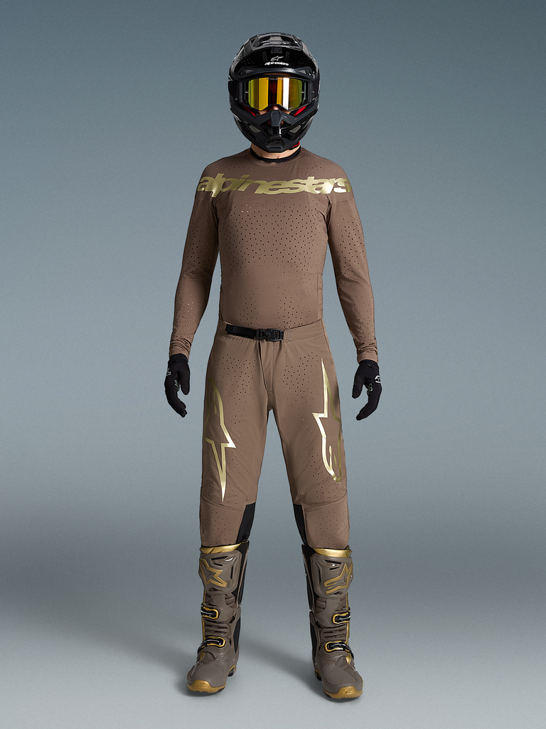 Limited Edition Supertech Air Gold Gear Set, tan motocross outfit with metallic gold logos, matching boots and helmet.