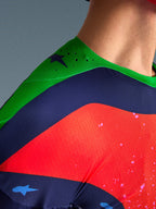 Close-up of the Alpinestars Limited Edition Supertech Records Jersey, multicolor design with green shoulder, navy and red panels, featuring laser-cut perforations and breathable mesh fabric for professional motocross performance.