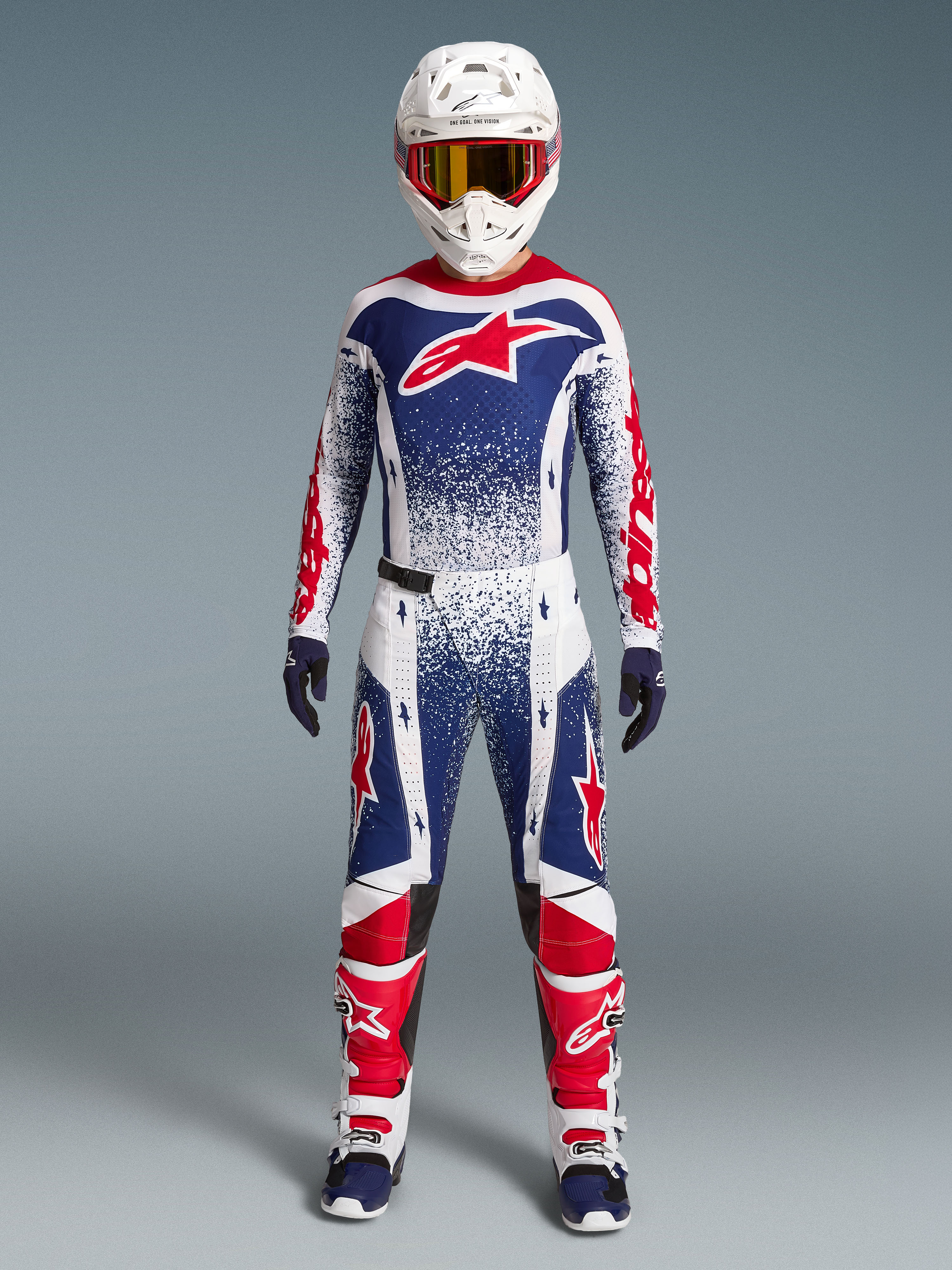 Alpinestars Limited Edition Techstar Unity motorcrossuitrusting, rood, wit en blauw set met sterrengrafieken.