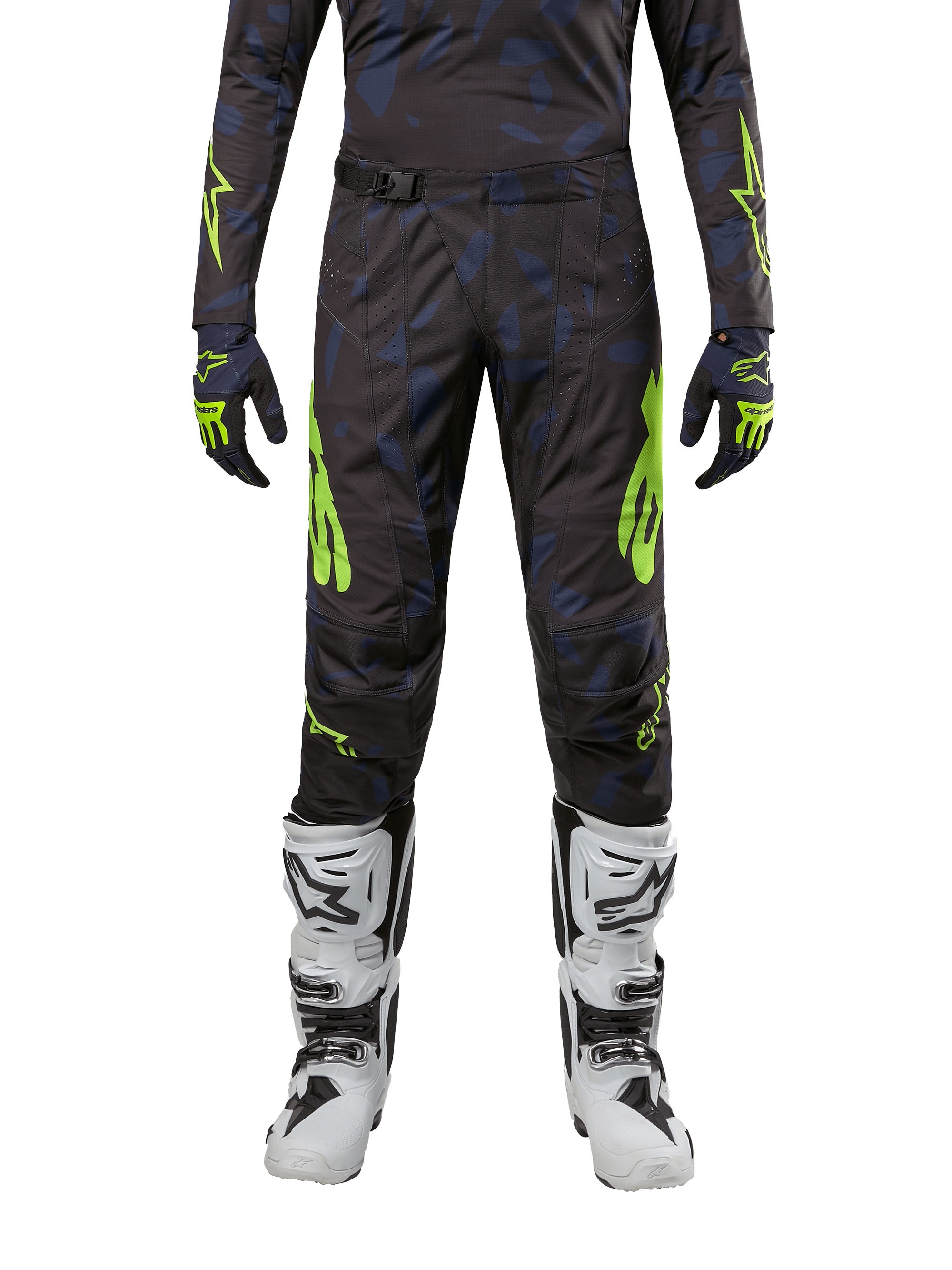 Alpinestars 2024 Techstar Rantera crossbroek, motorcross broek, zwart, navy en fluogeel, gedragen met bijpassende jersey met lange mouwen, handschoenen en witte motorcrosslaarzen, met opvallende neongele accenten en een abstract donker patroon.