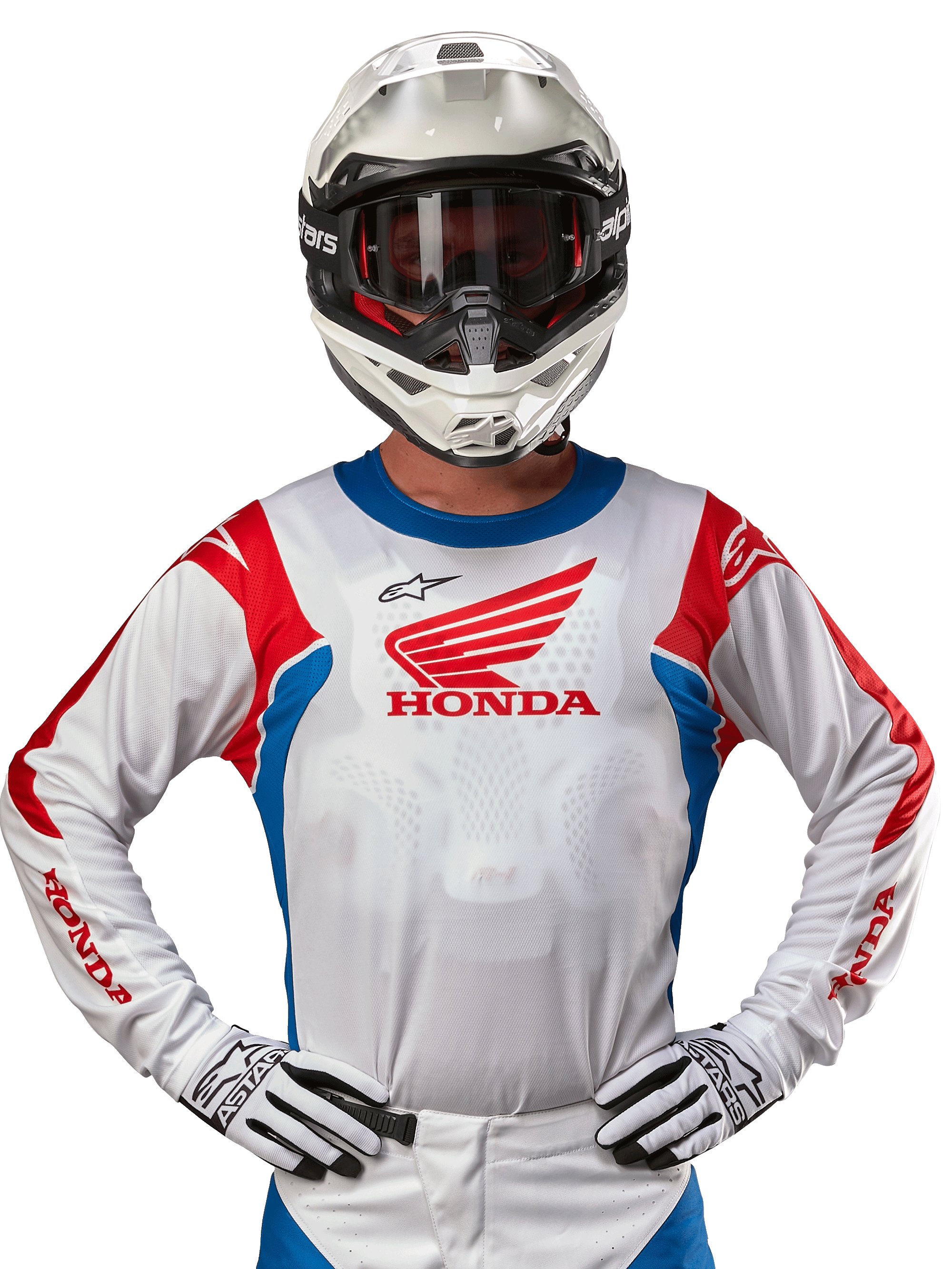 Alpinestars Honda Racer Iconic Jersey, wit motorcross shirt met een rood Honda-logo en felblauwe en rode accenten, gedragen door een rijder met een witte helm en handschoenen, prestatiegerichte kleding voor off-road en motorcross