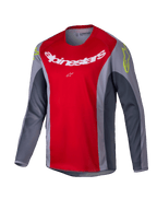 Alpinestars 2025 Youth Racer Melt Jersey, jeugd motorcrossshirt, felrood en grijs, voorzien van een groot wit logo op de borst en neongele accenten op de schouders, technische stof met lange mouwen voor off-road rijden