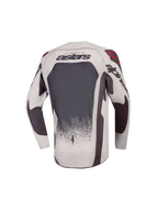 Alpinestars Jeugd Supertech Swan Jersey 2027, motocrossjersey voor kinderen, achteraanzicht, grijs en donkergrijs met rode accenten, geventileerd stretchmesh, atletische racepasvorm.