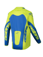 Alpinestars 2025 Youth Racer Veil Jersey, motocross jersey, fluogeel en blauw, achteraanzicht met opvallende blauwe panelen en Astars-branding op de mouwen, langer achterpand voor bedekking, lichtgewicht vochtafvoerende stof voor off-road racen.