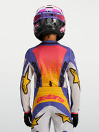 Alpinestars Jeugd Fluid Drag Jersey 2027, blauw en geel, achteraanzicht van motocrossjersey met race-geïnspireerde graphics.