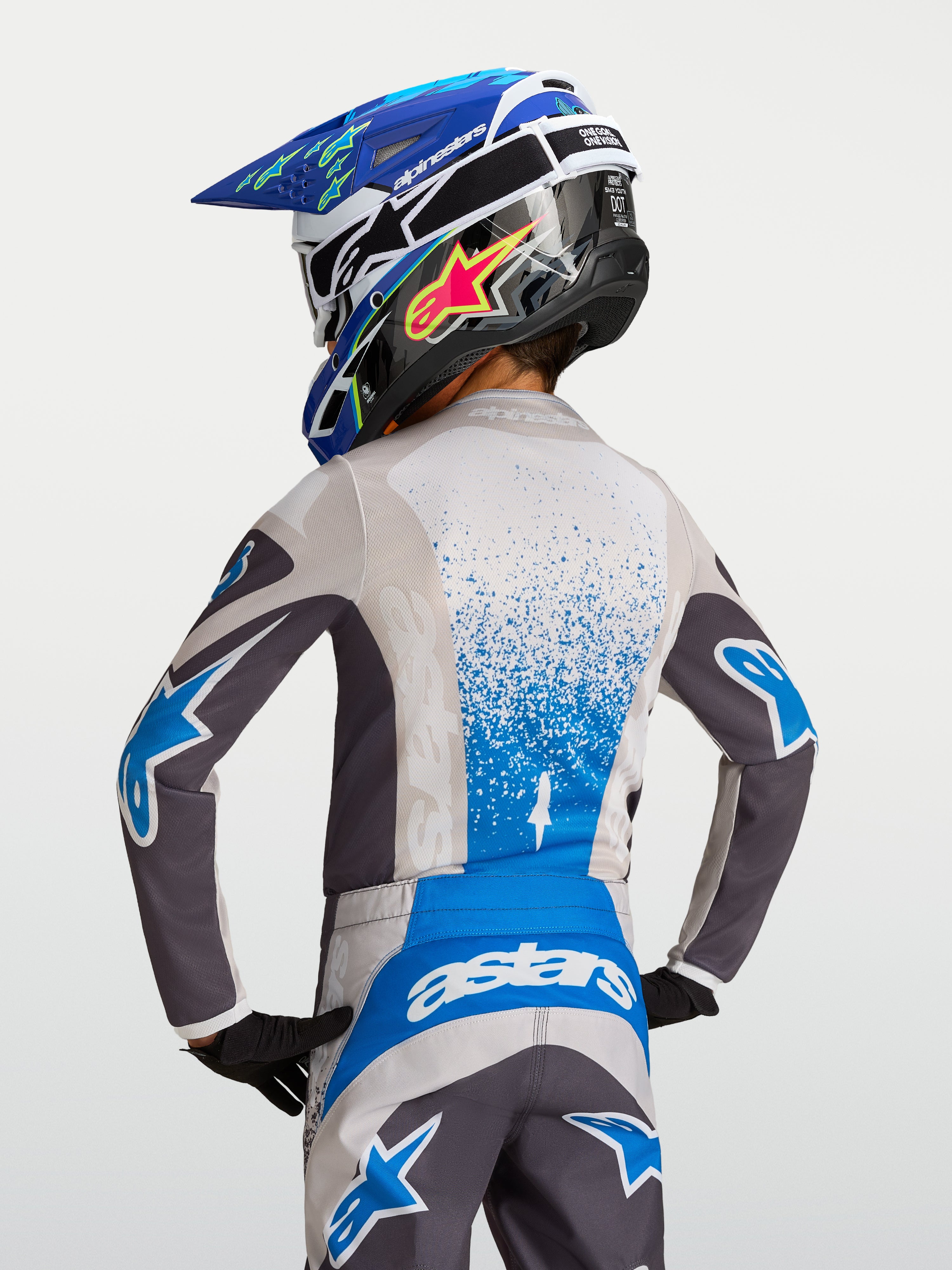 Alpinestars Jeugd Fluid Drag jersey, grijs en blauw vochtafvoerende motorcrossjersey voor kinderen, van achteren gezien.