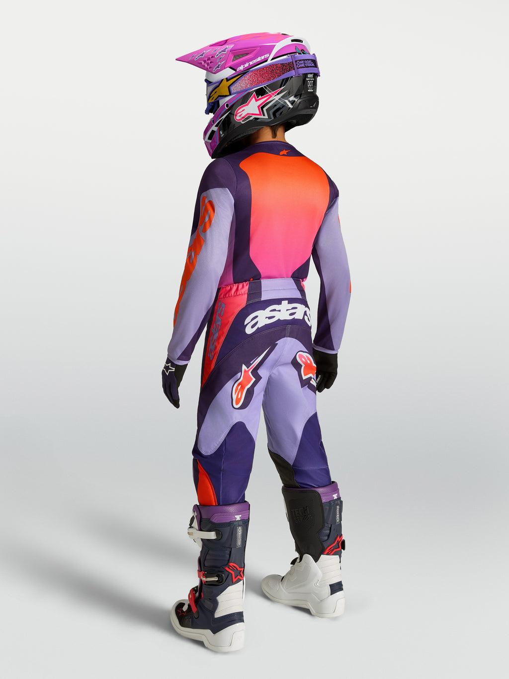 Alpinestars Jeugd Fluid Hunt gear set 2027, motorcrossuitrusting voor de jeugd, paars en neonroze, achteraanzicht.