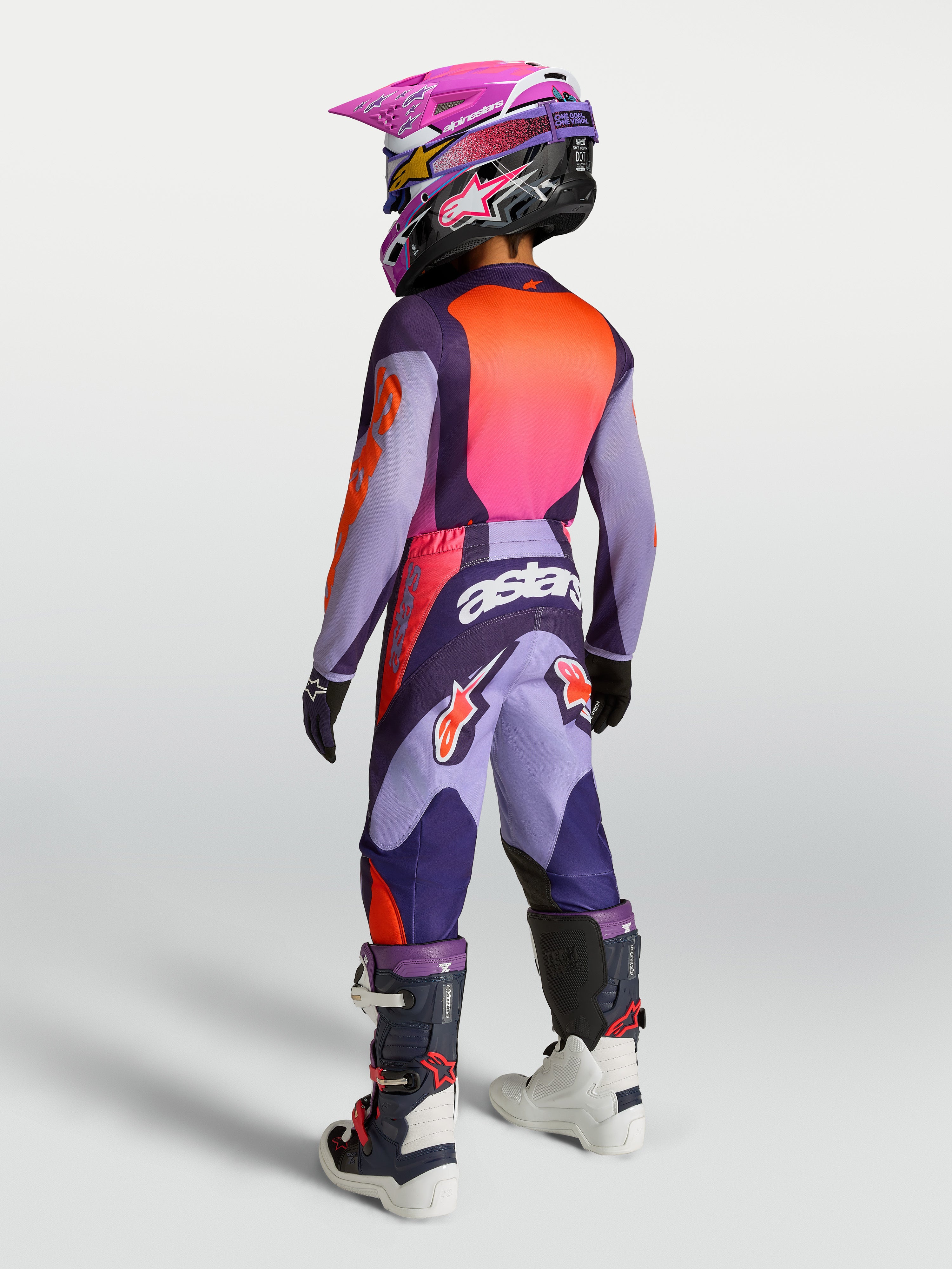 Alpinestars Jeugd Fluid Hunt gear set 2027, motorcrossuitrusting voor de jeugd, paars en neonroze, achteraanzicht.