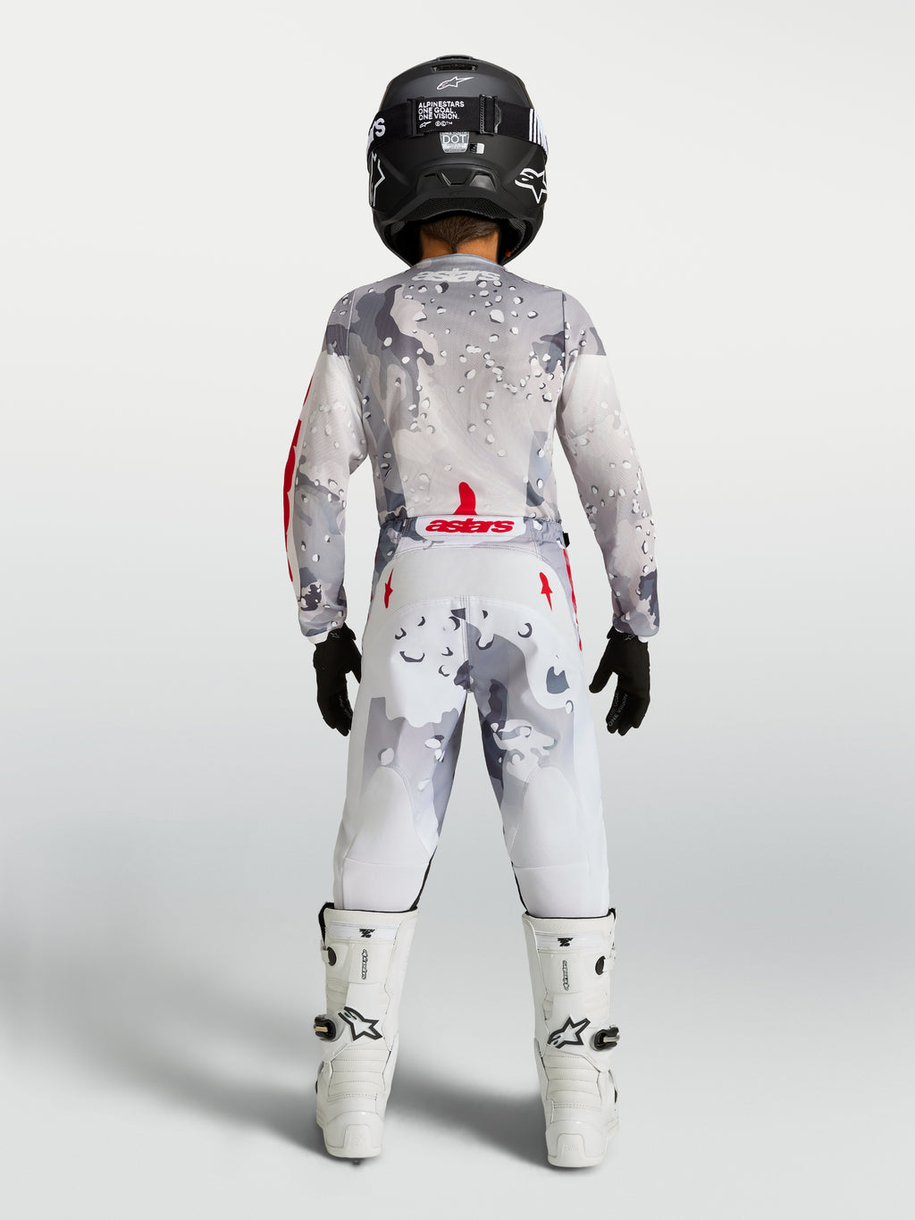 Alpinestars Jeugd Fluid Lone jersey en gear set 2027, motorcrosskleding voor kinderen, grijs camouflage en wit met rode accenten, achteraanzicht.
