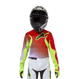 Alpinestars Youth 2024 Racer Lucent Jersey, Motocross Jersey, White Neon Red and Yellow Fluo, featuring a red and neon yellow design with a black star logo, worn with matching black helmet, white pants, and neon gloves for a professional off-road racing kit.