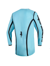 Alpinestars 2026 Woman Stella Fluid Apex Jersey, Motocross Jersey, Light Blue with Black accents, back view showing curved vertical stripes, Alpinestars branding on the sleeve, and extended rear cut for off-road performance.