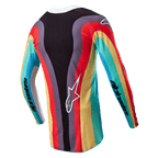 Alpinestars Stella 2024 Techstar Jersey, dames motorcross shirt, zwart multicolor, achteraanzicht met een levendig golvend veelkleurig patroon in rood, geel en turkoois, wit Astar-logo onderaan de rug, Alpinestars-branding op de mouwen.