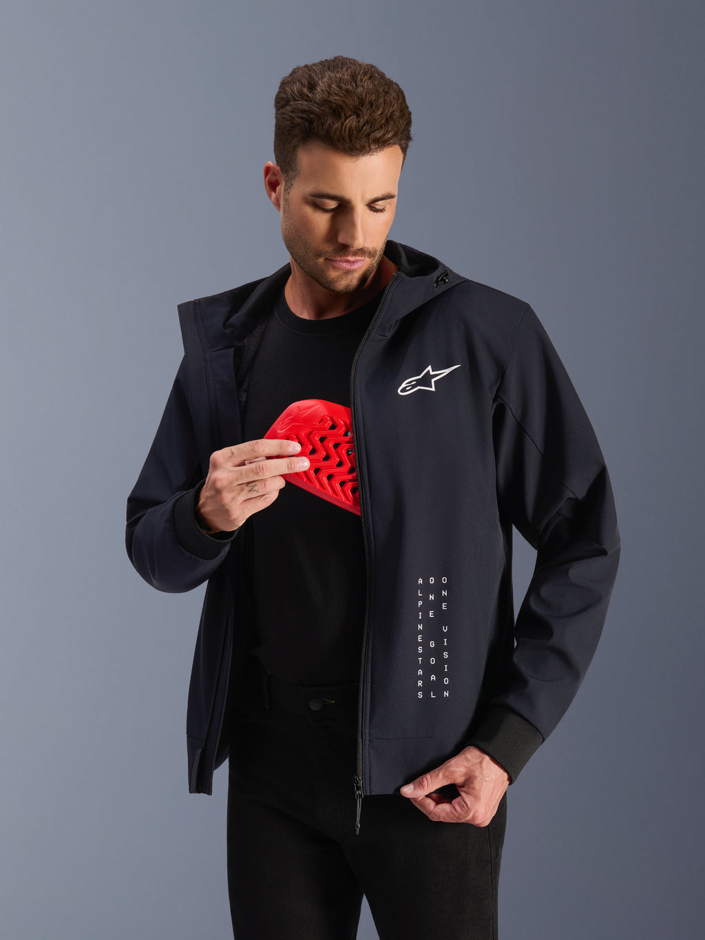 Alpinestars Radium Tech Hoodie, black urban motorcycle jacket featuring a red Nucleon Flex Plus armor insert.