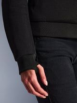 Close-up of Alpinestars Stella Chrome Superairflow Hoodie, Black, featuring detailed 3D mesh textile and ribbed stretch cuff with an integrated thumb loop for a secure fit.