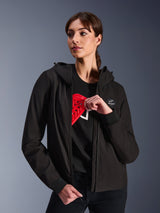 Alpinestars Woman Stella Radium Tech Hoodie, Black urban riding hoodie, female model demonstrating red Nucleon Flex Plus armor inside, lightweight 3-layer windproof textile shell with ribbed cuffs and chest logo patch, protective motorcycle apparel