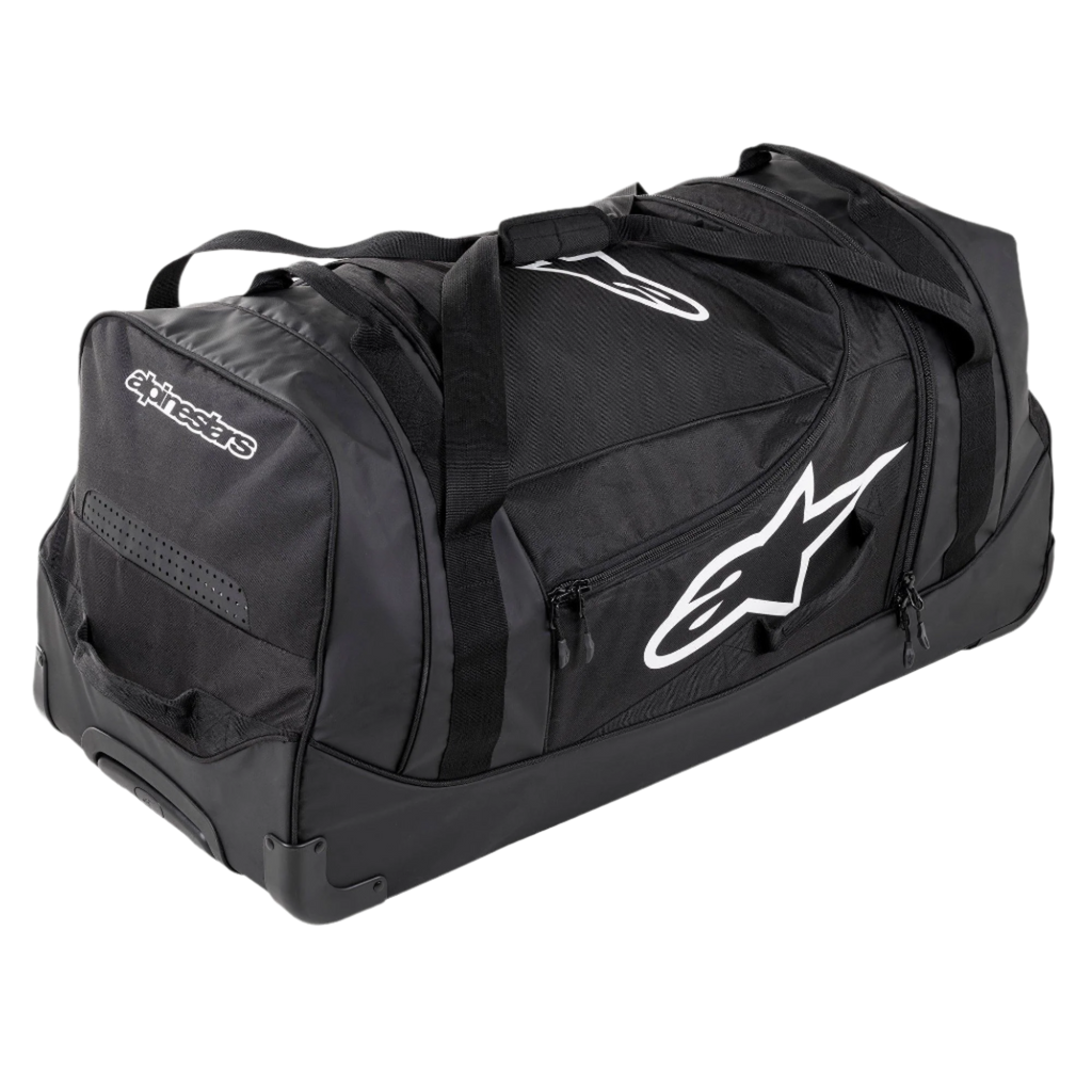 Alpinestars Komodo Reistas, grote reistas voor uitrusting, zwart met witte Alpinestars-logo's, voorzien van stevige wielen, versterkte handgrepen en meerdere compartimenten met ritssluiting voor het georganiseerd opbergen van race-uitrusting