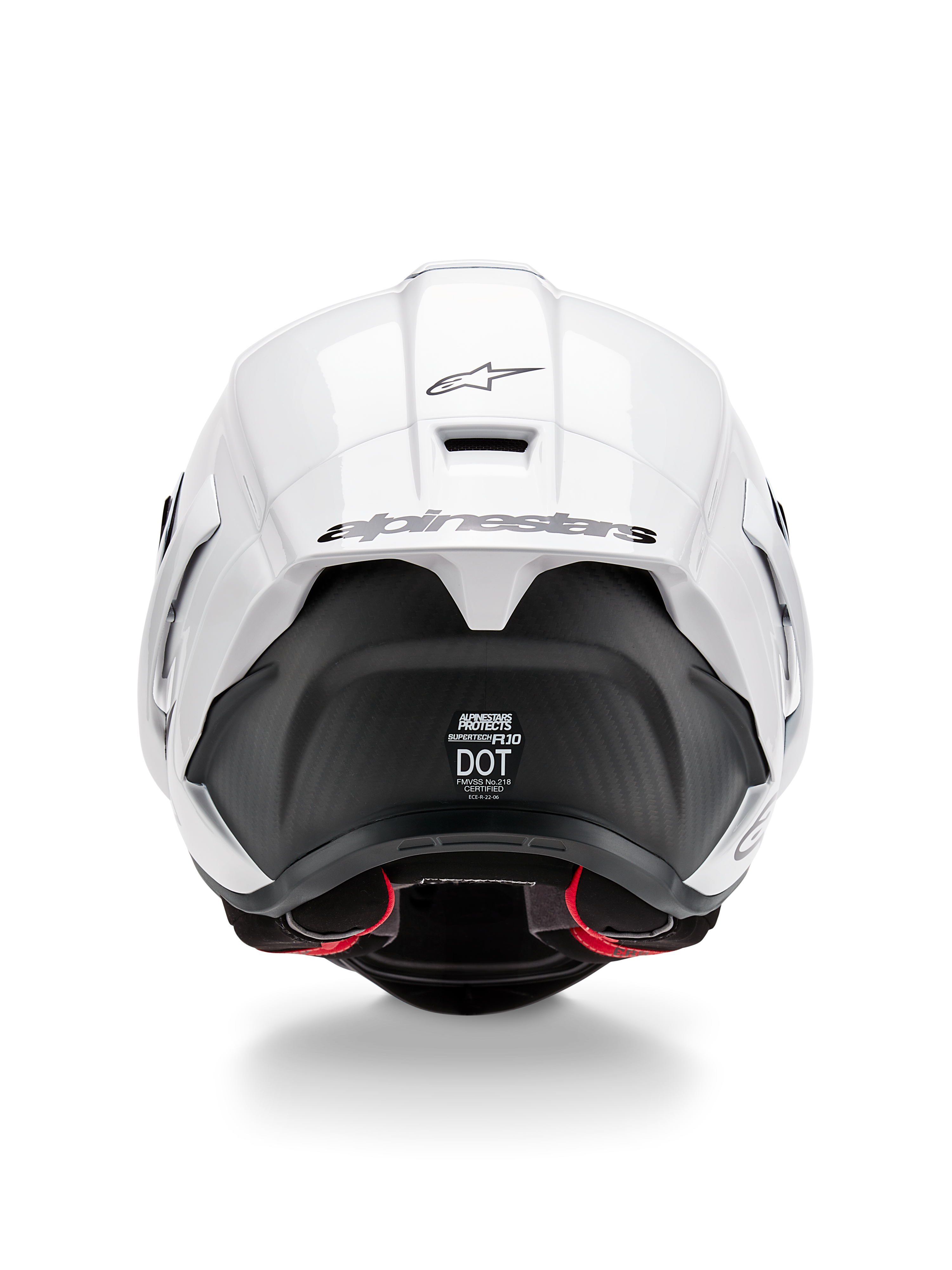 Alpinestars Supertech R10 Solid Helmet, Rear view, White Glossy top with Black Matte lower section, aerodynamic spoiler with black Alpinestars logo, visible carbon fiber texture, and safety certification decals