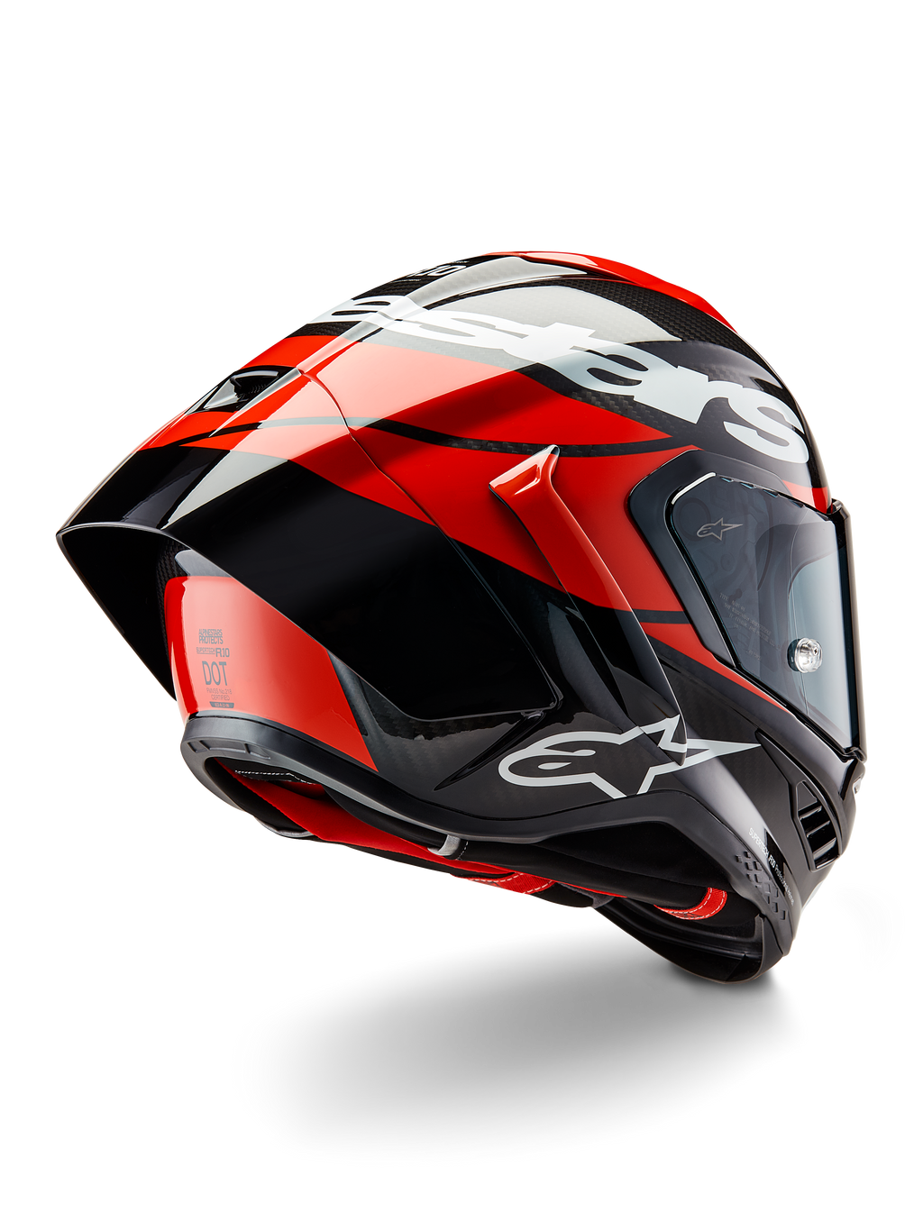 Alpinestars Supertech R10 Element helm, zwart carbon, felrood en glanzend wit, driekwart achteraanzicht met grote aerodynamische spoiler en carbonvezel schaal, voorzien van opvallende Alpinestars-logo's en DOT-certificering