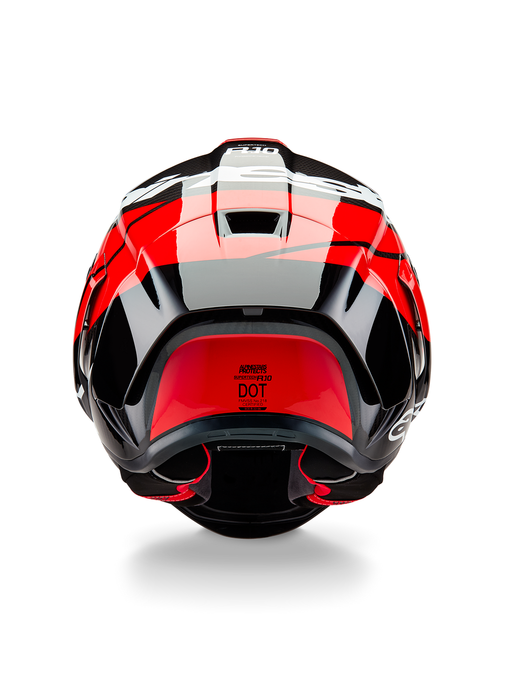 Alpinestars Supertech R10 Element helm, achteraanzicht, zwart carbon met felrode en witte glanzende accenten, voorzien van een aerodynamische achterspoiler, ventilatieopeningen en DOT-certificeringslabel, strak race-geïnspireerd ontwerp met carbonfiber details