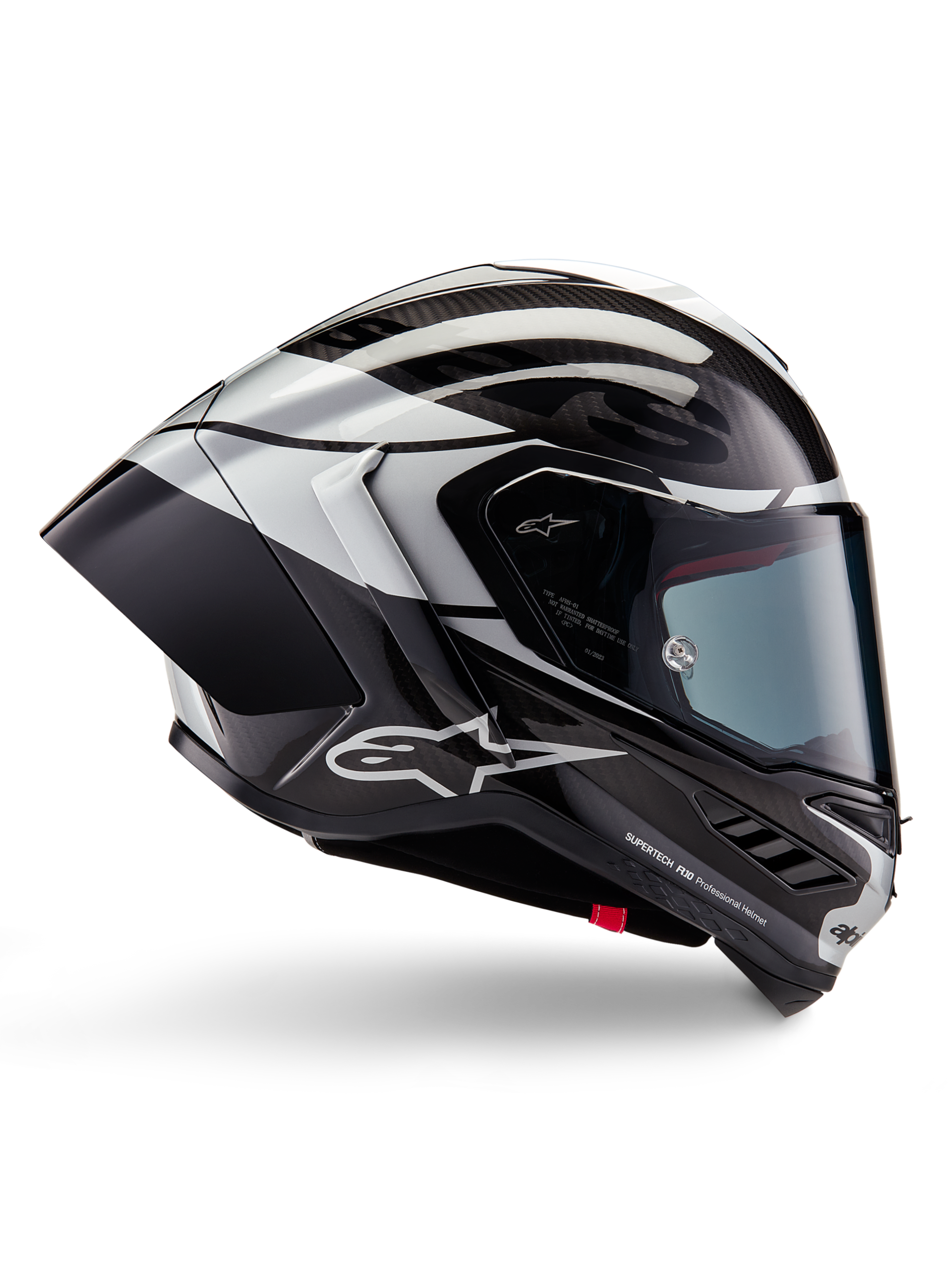 Alpinestars Supertech R10 Element helm, integrale motorracehelm, zwart carbon, zilveren en zwart glanzende afwerking, zijaanzicht met aerodynamische koolstofvezel schaal, helder vizier en opvallende Alpinestars-branding