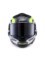 Alpinestars Supertech R10 Arius Helm, motorracehelm, zwart, zilver en fluorgeel glanzend, vooraanzicht met carbonfiber schaal, donkergetint vizier en geïntegreerd ventilatiesysteem.