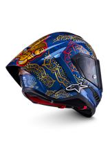 Alpinestars Supertech R10 Martinator Thai-helm in glanzend blauw met gouden mandala-patronen en aerodynamische spoiler.