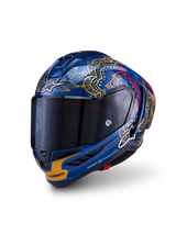 Alpinestars Supertech R10 Martinator Thai-helm, blauw carbon met gouden graphics en een donker getint vizier.