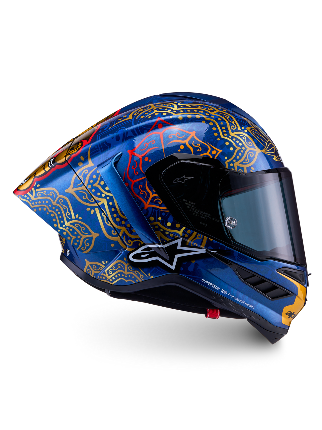 Supertech R10 Martinator Thai-helm van blauw carbon met gouden mandala-graphics en een aerodynamisch raceprofiel.