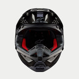 Alpinestars Supertech M10 Solid Helmet, Motocross Helmet, Black Glossy Carbon, front view showing red interior lining, carbon fiber shell, and "ONE GOAL. ONE VISION." slogan on the visor area